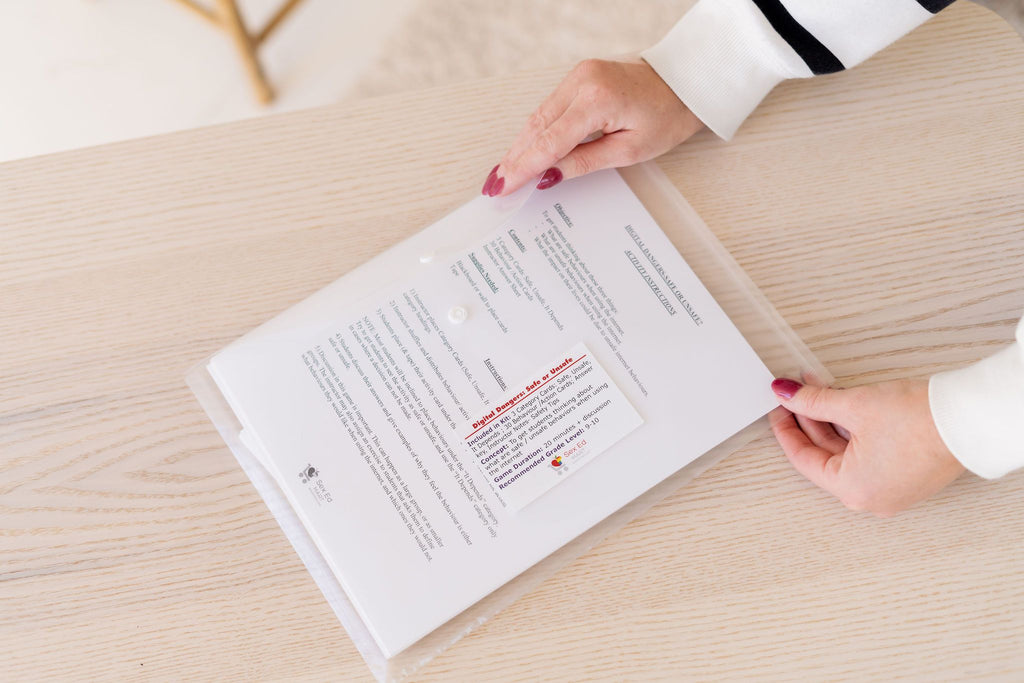 Digital Dangers: Safe or Unsafe activity kit instructions and category card in a clear folder