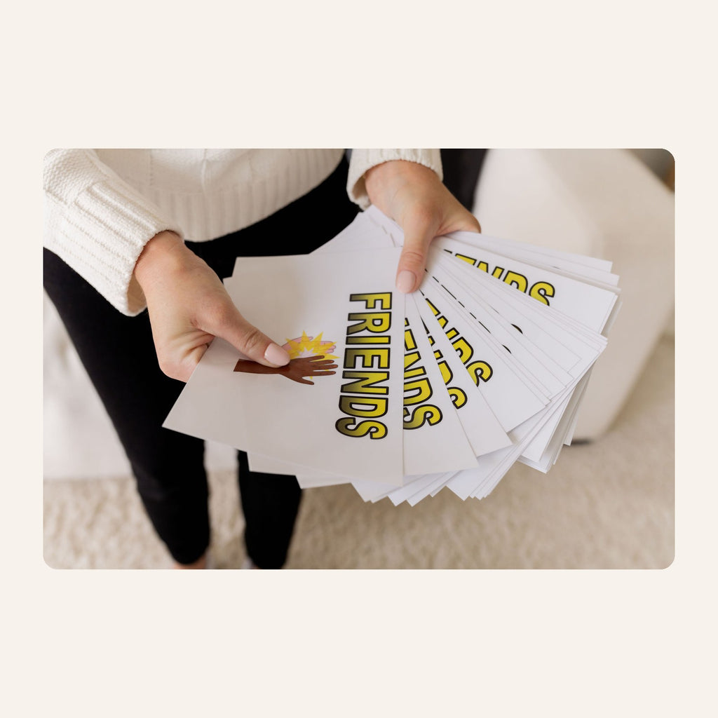 Let's Be Friends activity cards fanned out, each printed with the word Friends